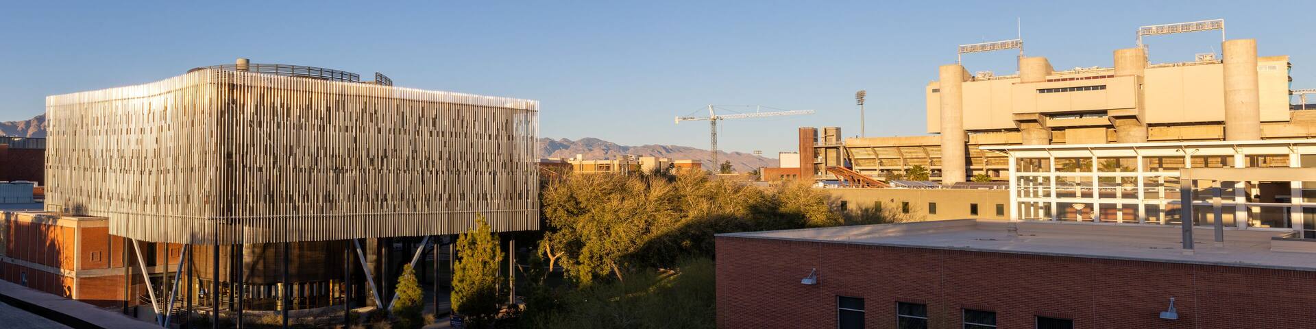 University of Arizona academic building with the football stadium in the distance