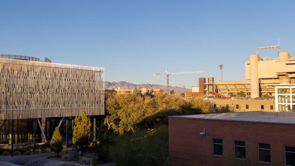 University of Arizona academic building with the football stadium in the distance