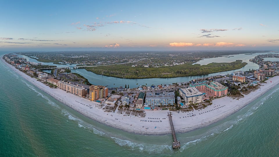 Drone panorama over Redington Beach in St. Petersburg in Florida with pier at sunset