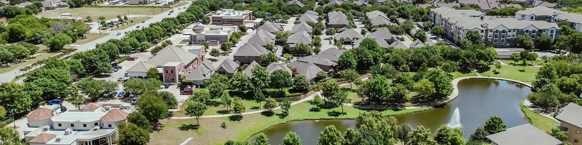 Panorama aerial view busy Keller Parkway along fast-growing area mixed of commercial buildings, residential houses, apartment complex in bursting green Keller, Texas, Dallas Fort Worth metroplex