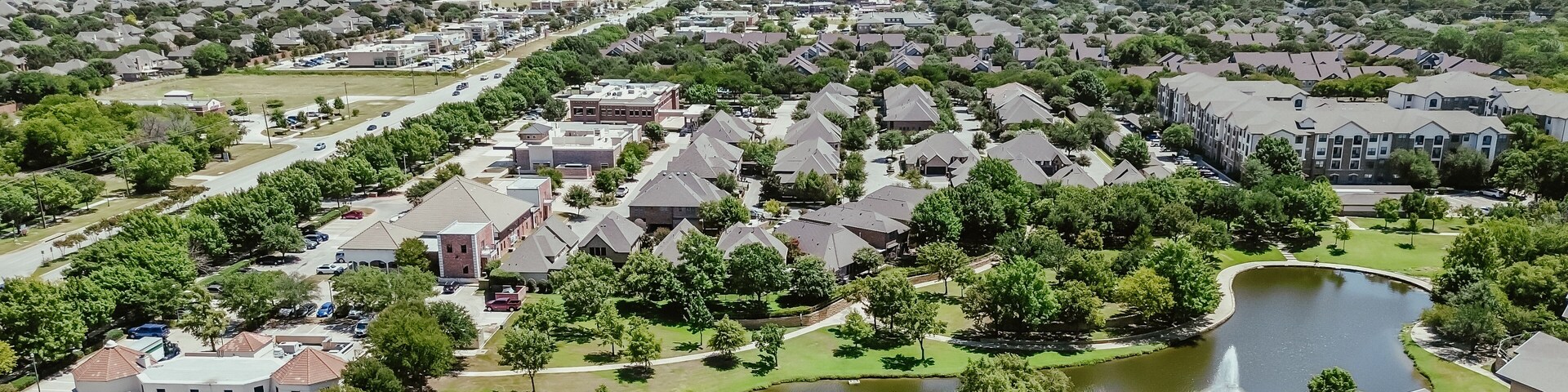 Panorama aerial view busy Keller Parkway along fast-growing area mixed of commercial buildings, residential houses, apartment complex in bursting green Keller, Texas, Dallas Fort Worth metroplex