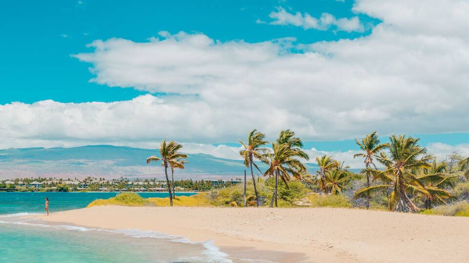 Hawaii beach panoramic travel banner of woman tourist walking on secluded shore in Waikoloa, Big Island, USA.