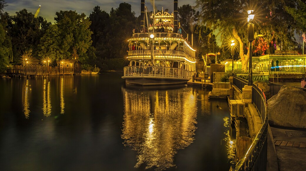 Anaheim, California, USA - July 27, 2023: Night view of a luxury steamboat with light moored on the river at the marina of Disneyland