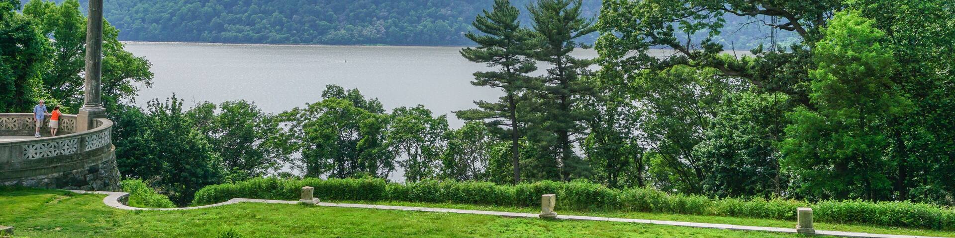 Yonkers, New York, USA: A young couple views the Palisades, across the Hudson River from the Untermyer Park and Gardens in Yonkers, New York.