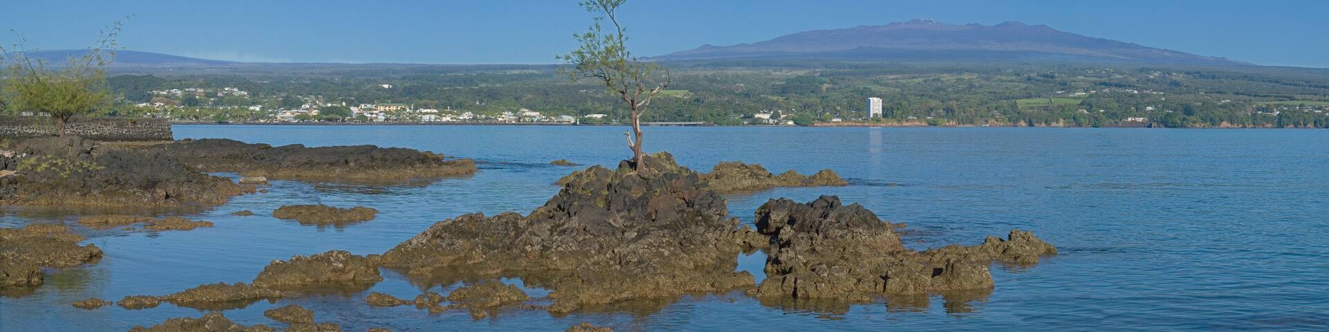 View of Mauna Kea and Mauna Loa from Queen Liliuokalani Gardens, Hilo, Big Island, Hawaii