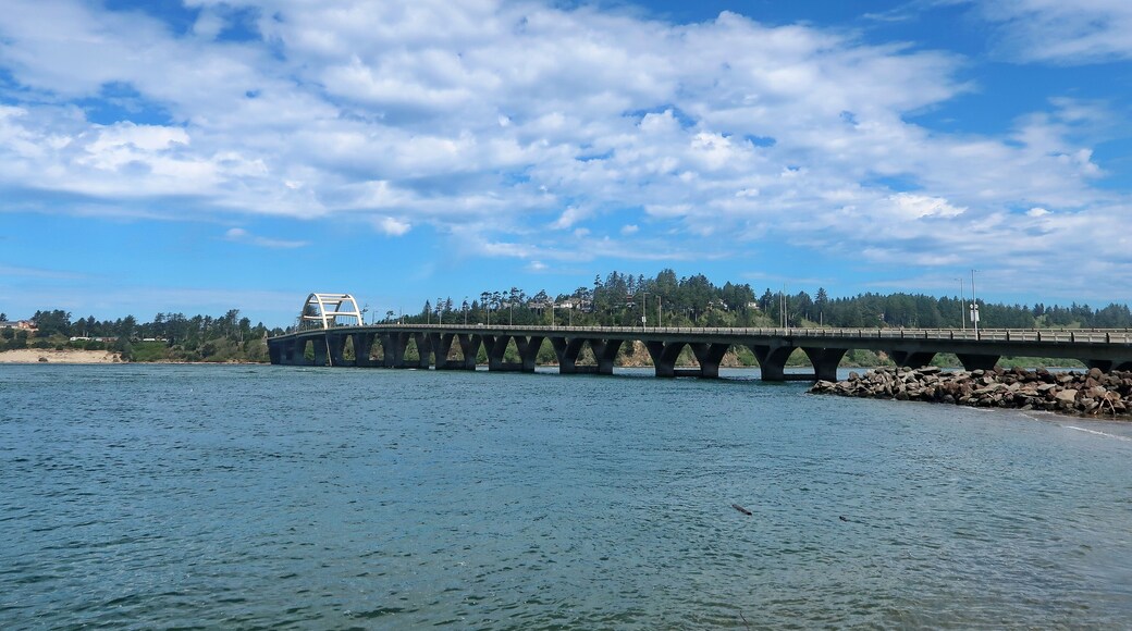 The Alsea Bay Bridge along coastal highway 101 connects Waldport and Bayshore on the Central Oregon Coast on a sunny spring day.