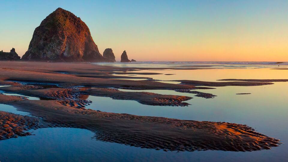 Haystack Rock at Cannon Beach, Oregon at sunset