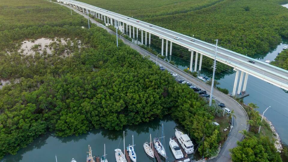 Boats moored in a marina off the Highway 1 in Key Largo, Floriday Keys, Florida, United States.