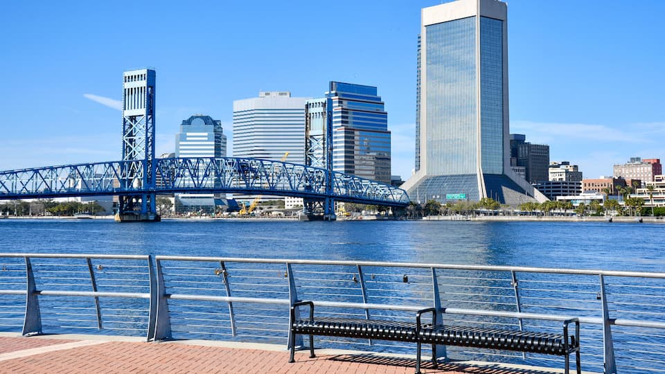 View of the Mainstreet Bridge over the St Johns River and downtown Jacksonville from the Southbank Riverwalk in Duval County, Florida.