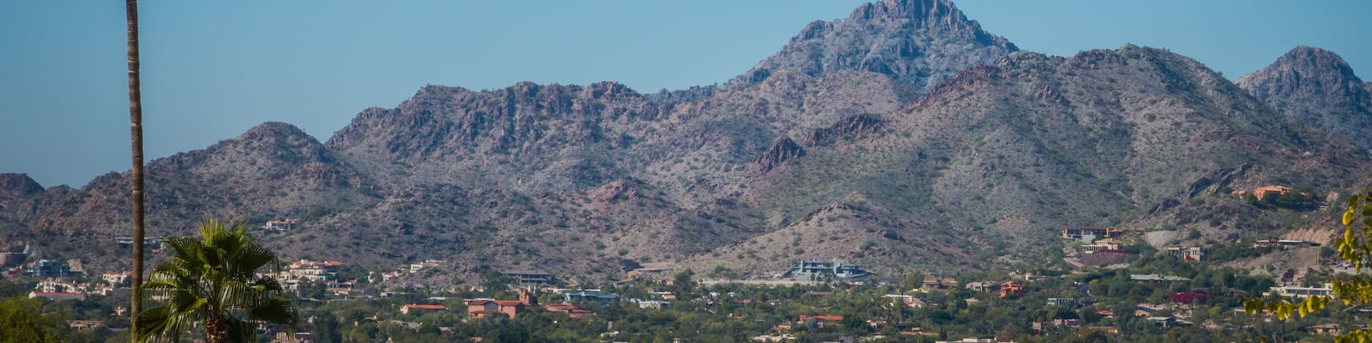 Neighborhoods at the base of tall mountains are rapidly growing in the Phoenix, Arizona area where population is steadily growing. Housing in these mountain base developments are usually more expensiv