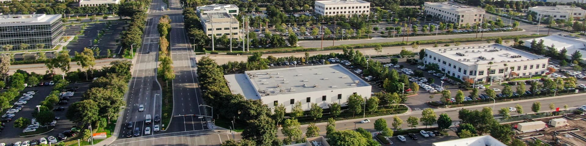 Aerial view of business and finance district with new office building surrounded by parking and road. Irvine Business Complex. Irvine California. USA