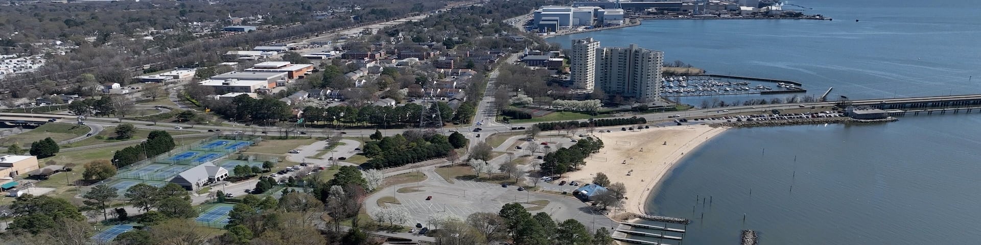 Newport News, VA coastline living by James river landscape with city streets public parks resort hotels and neighborhoods on warm sunny day in Virginia