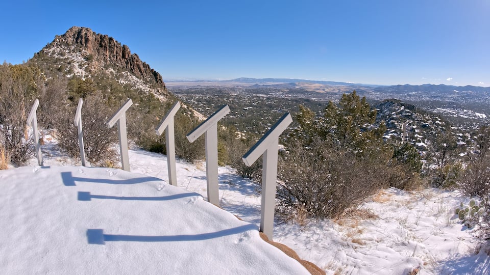 View from Picnic Hill along the Thumb Butte day use hiking trail in the Prescott National Forest just west of Prescott Arizona, covered in winter snow and ice.