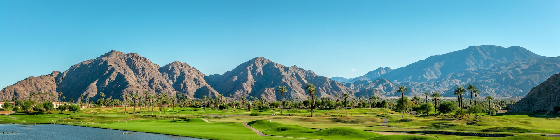 Golf course panorama in Palm Springs, Coachella Valley mountains web banner, California