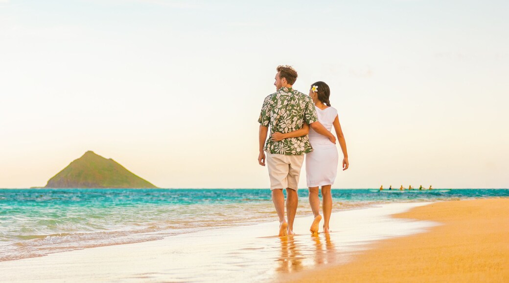 Couple walking on beach sunset vacation panoramic hawaii travel. Woman and man relaxing on tourist holiday in Lanikai, Oahu, Hawaii banner.