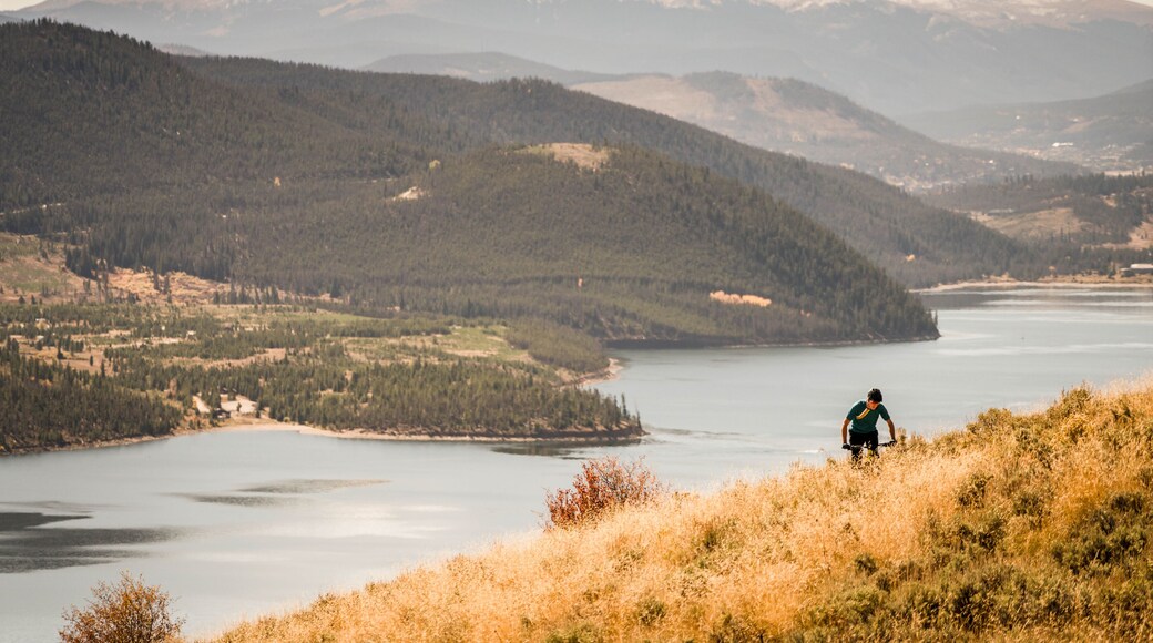 One man enjoying the splendor of the fall colors, mountain biking in Silverthorne. Summit County, Colorado.