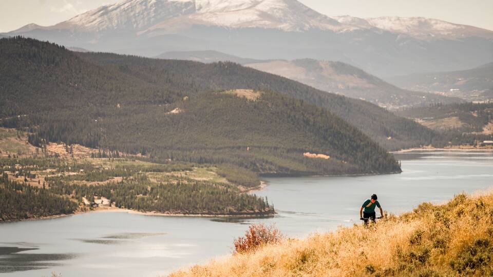 One man enjoying the splendor of the fall colors, mountain biking in Silverthorne. Summit County, Colorado.