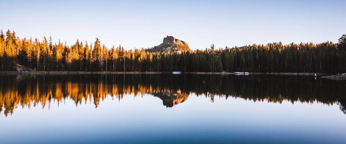 Devils Peak reflected in still peaceful lake, Donner Pass, California