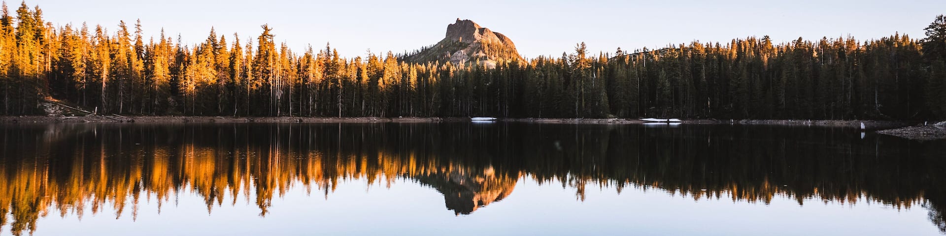 Devils Peak reflected in still peaceful lake, Donner Pass, California