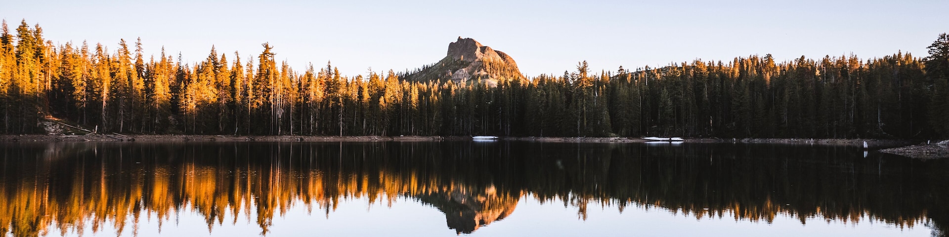 Devils Peak reflected in still peaceful lake, Donner Pass, California