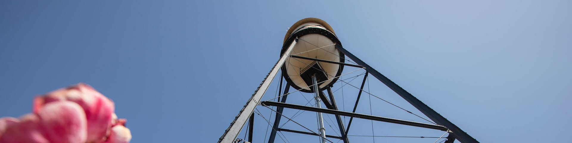 Campbell, California, USA - August 29, 2024: Afternoon sun shines on historic 1928 steel water tower of downtown Campbell.