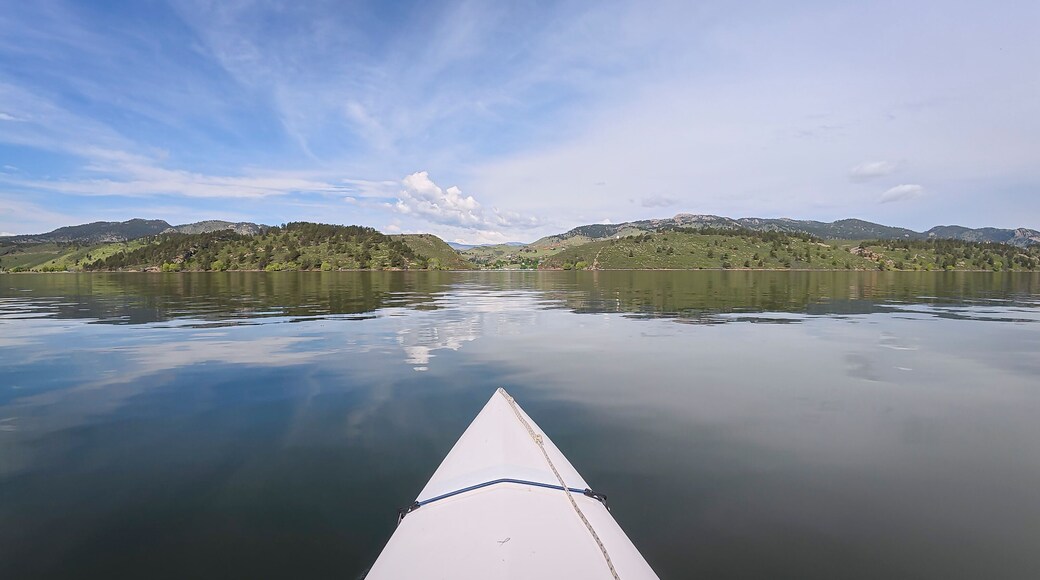 spring kayaking or canoeing on Horsetooth Reservoir at foothills of Rocky Mountains near Fort Collins, Colorado - POV paddler perspective