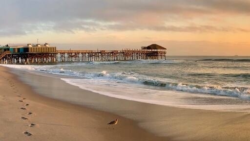 Sunrise at Cocoa Beach pier near Cape Canaveral on Florida's Space Coast