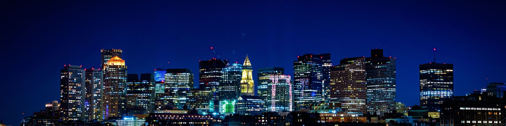 Panoramic Night Cityscape Boston Skyline over Boston Harbor
