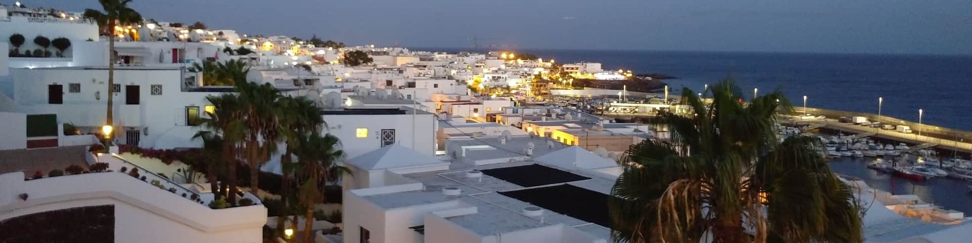 Puerto del Carmen is a resort town on the southeast coast of the Spanish island of Lanzarote. It’s home to beaches such as sandy Playa Grande and Matagorda, which is known for its steady breeze. Fishing boats cluster at the old town dock, El Varadero. Avenida de las Playas, a beachside boulevard, is lined with shops,restaurants and lively nightclubs. Just inland, Rancho Texas Lanzarote Park has a zoo. Wikipedia