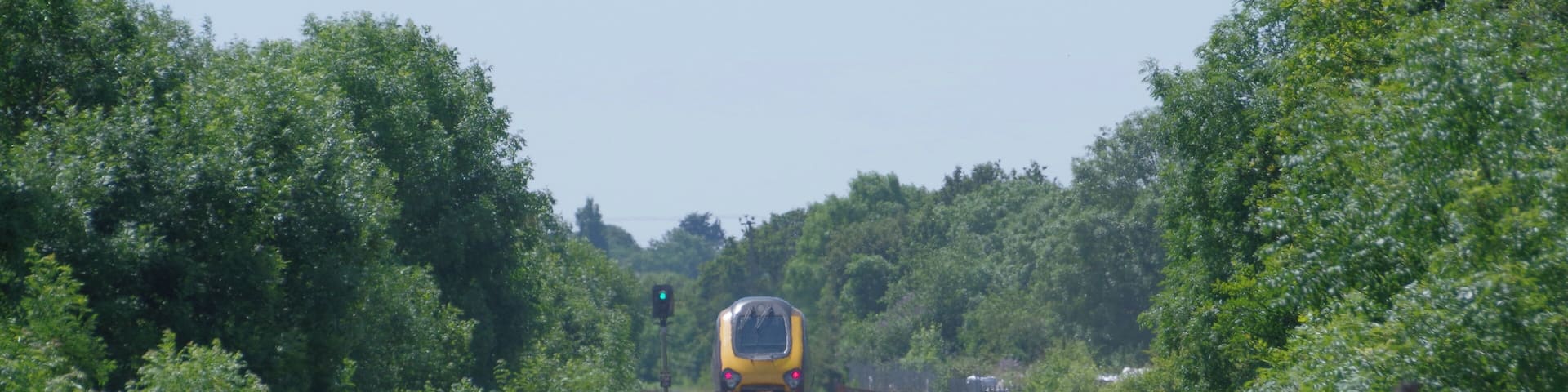 CrossCountry class 220 "Voyager" DEMU 220011 speeds west, away from Nailsea & Backwell railway station.
