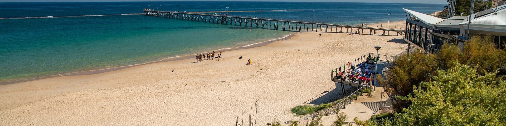Port Noarlunga Beach which includes general coastal views and a sandy beach