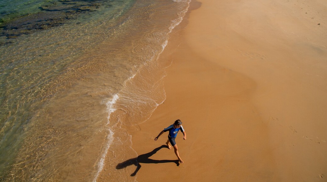 Port Noarlunga Beach which includes a beach and general coastal views as well as an individual child