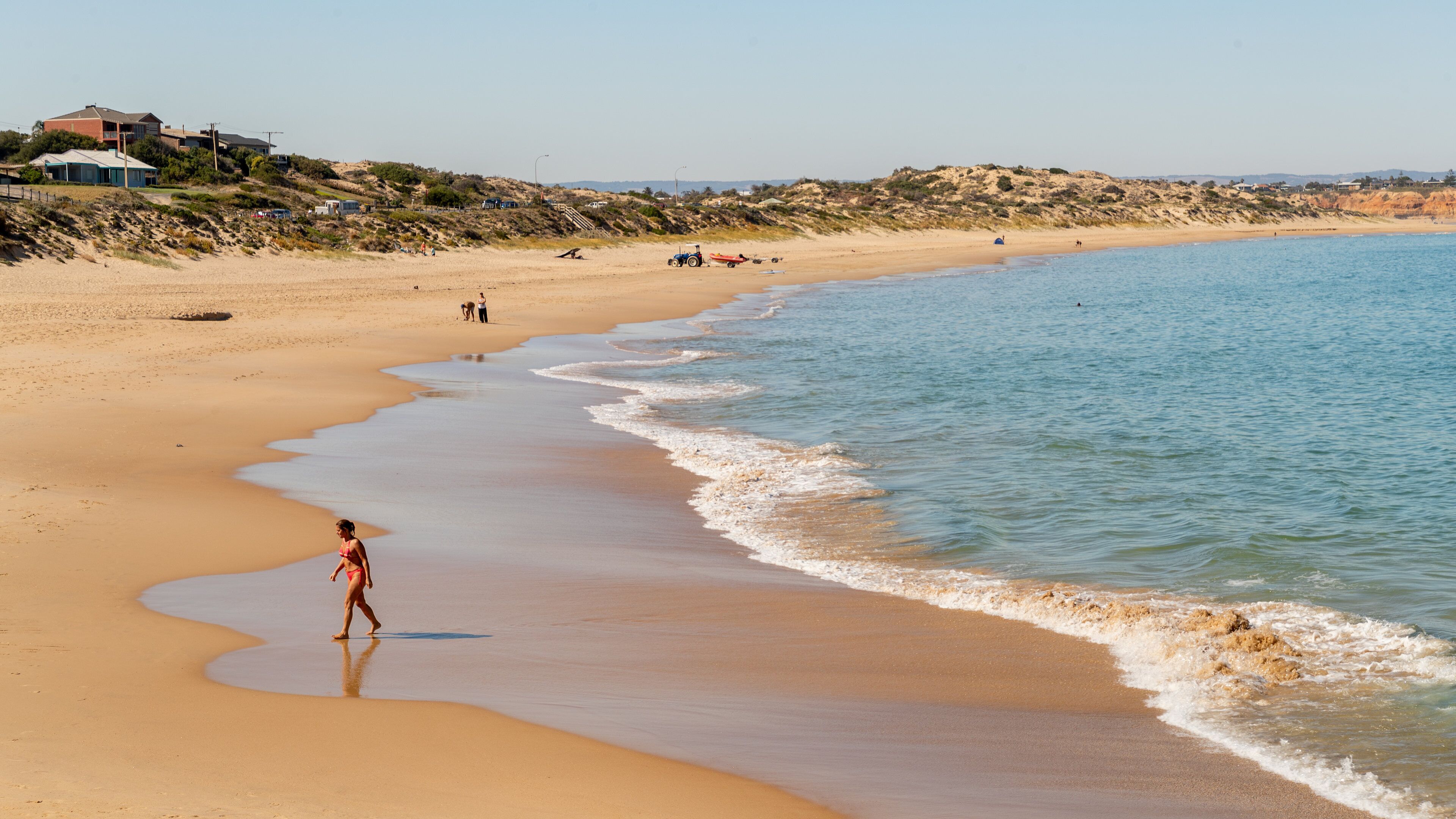 Port Noarlunga Beach featuring a sandy beach and general coastal views as well as an individual male