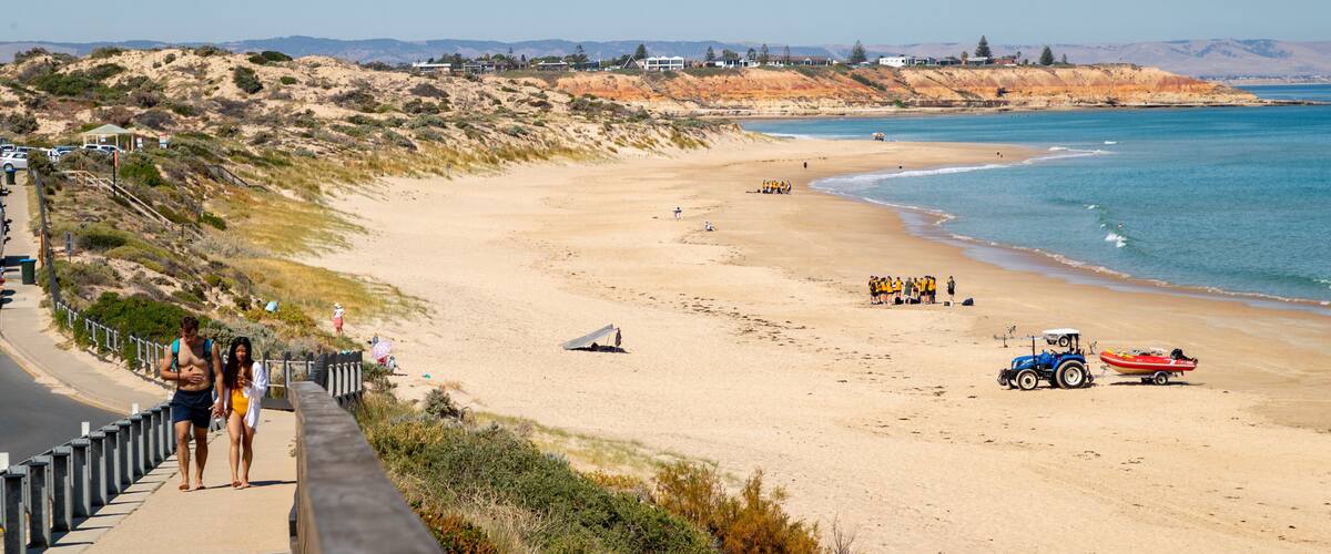 Port Noarlunga Beach showing a beach and general coastal views as well as a couple