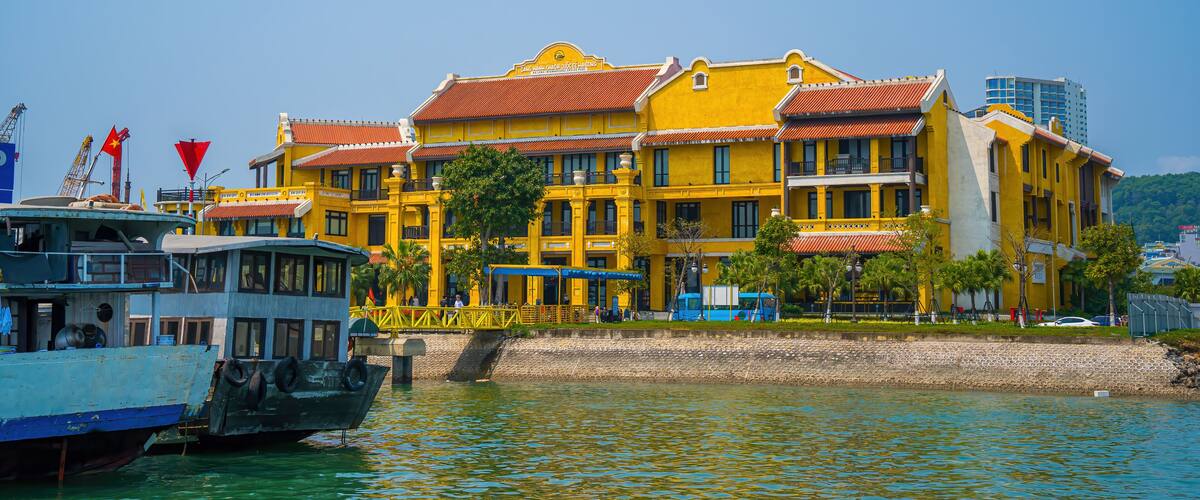 Ha Long, VIETNAM - MAR 12 2023: Ha Long International Cruise Port's Marina has many cruise ships. Touristic Boats start jorneys over the Halong Bay which is UNESCO World heritage