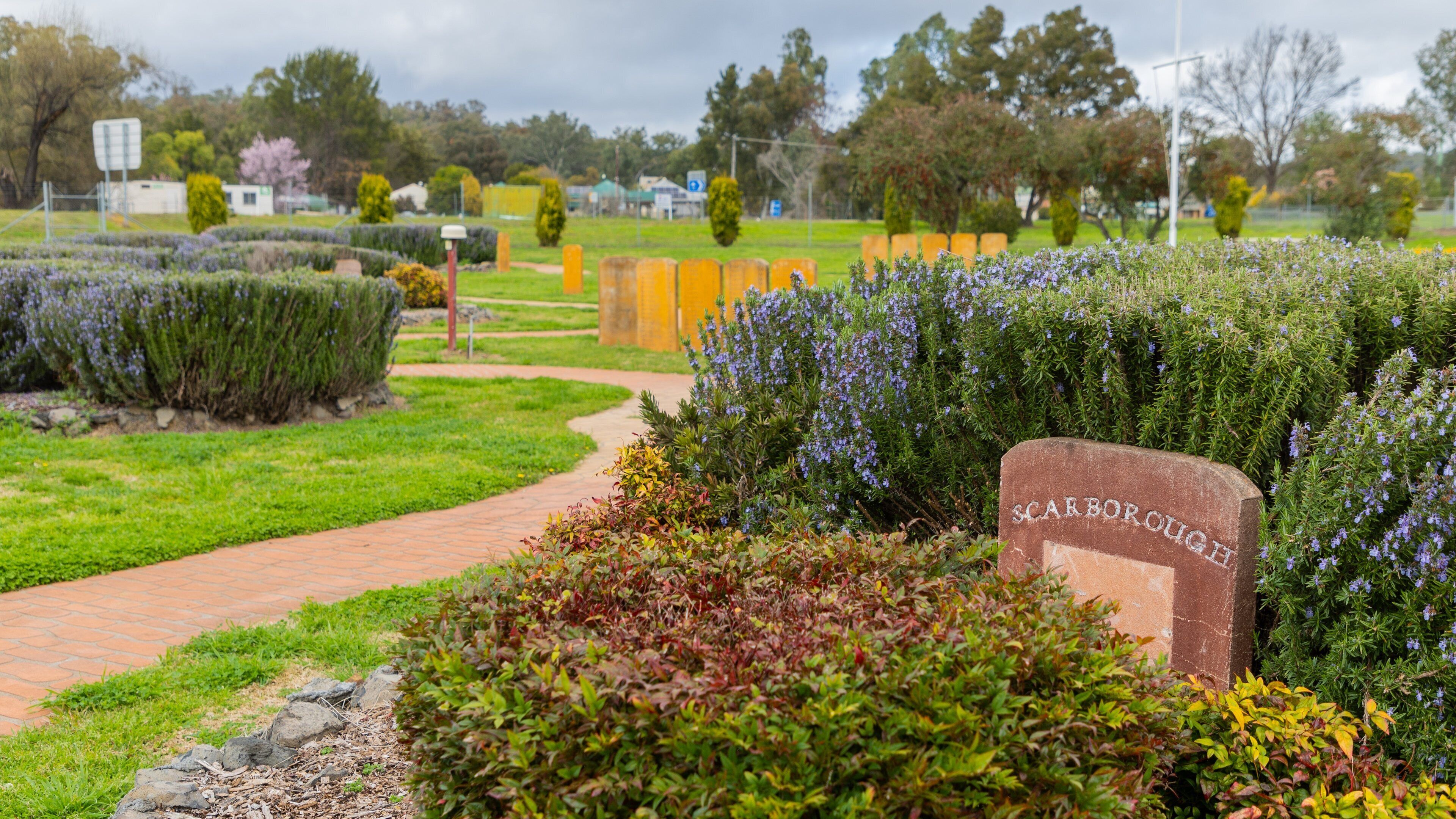 First Fleet Memorial Garden featuring a park, signage and wildflowers