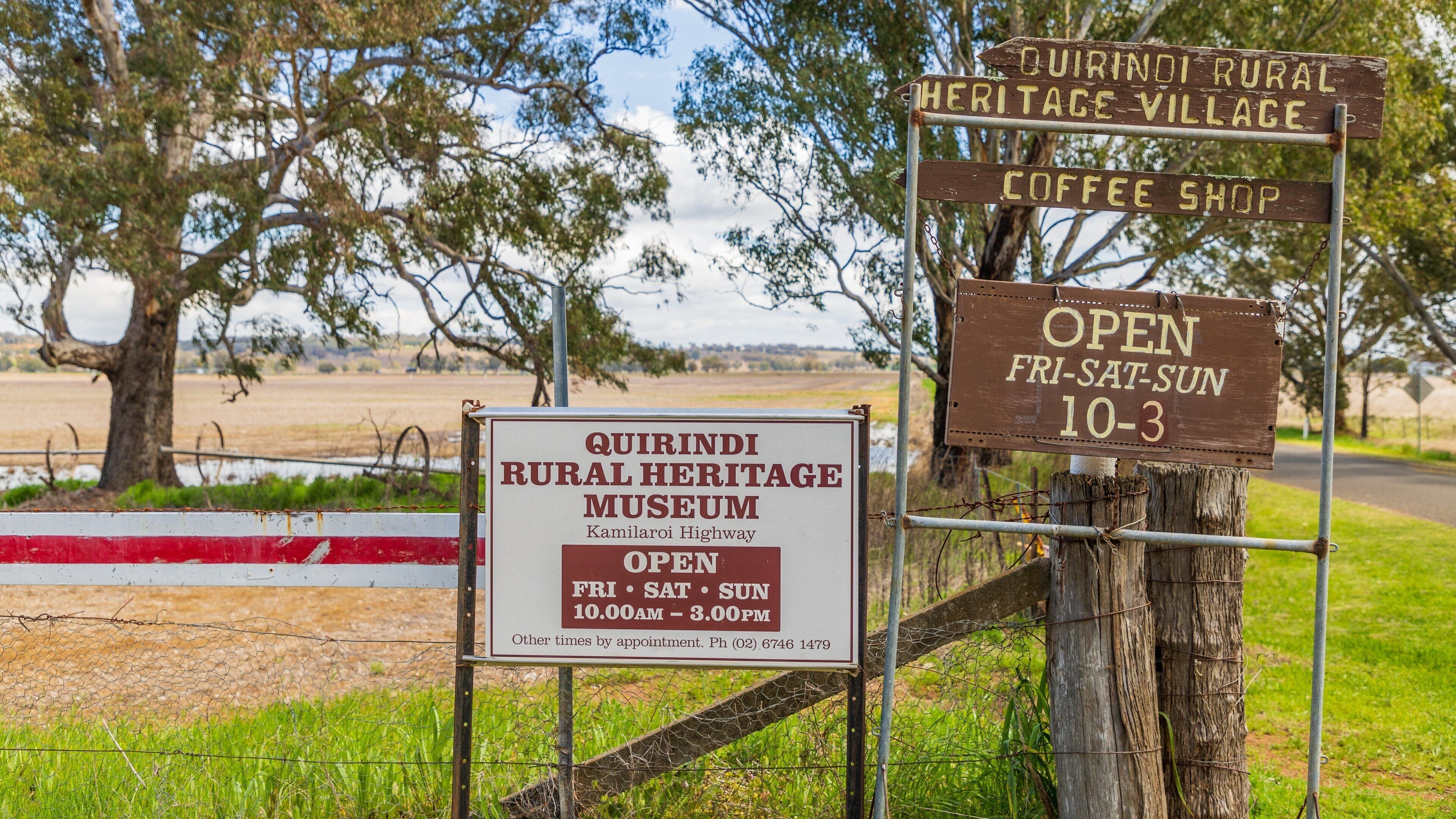 Signs for the Quirindi Rural Heritage Museum and a coffee shop.