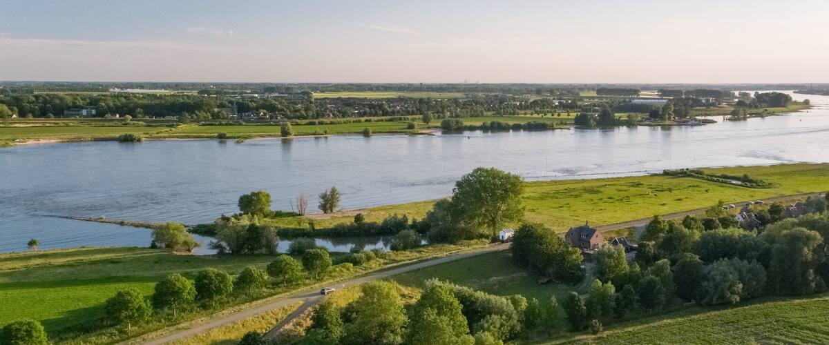 Panoramic shot of a Dutch landscape with the river Waal near the village of Herwijnen