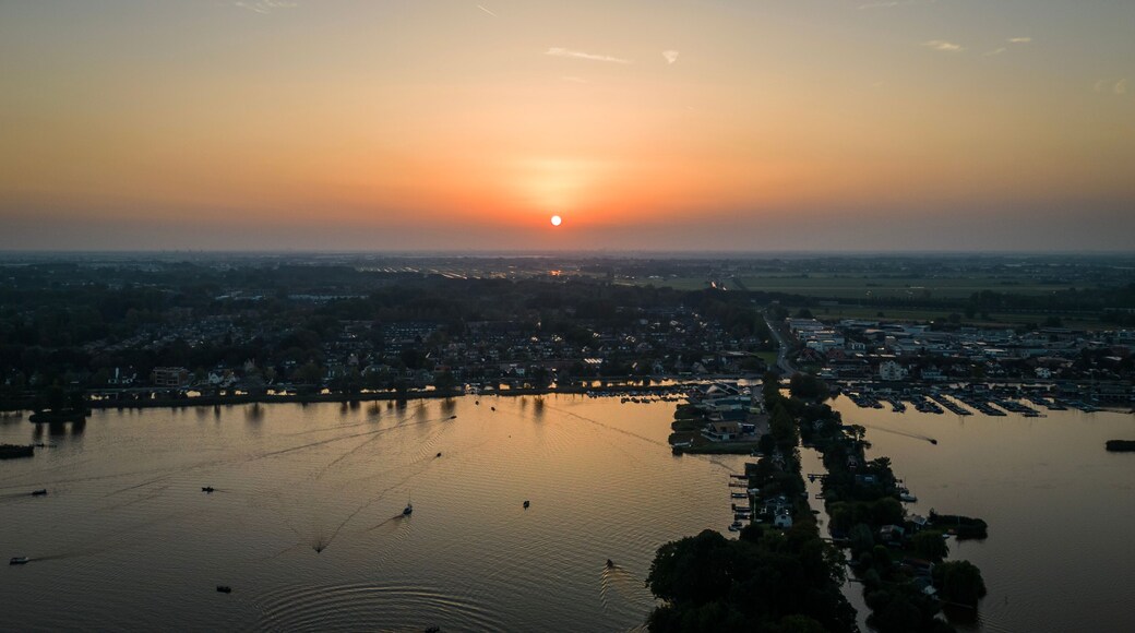 Sun sets on Elfhoeven Reeuwijkse Plassen wetland lake area of the Netherlands