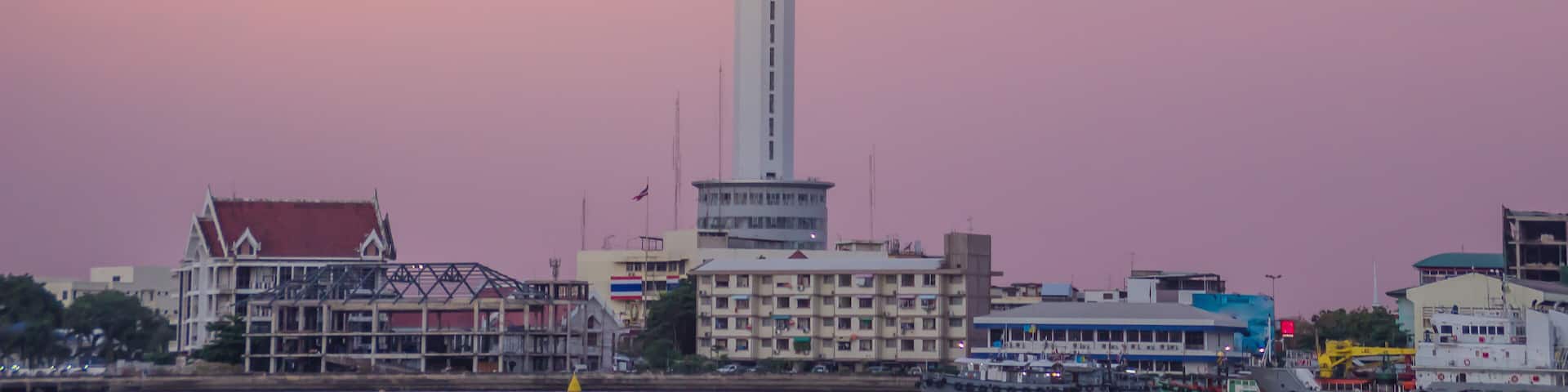 Riverfront view of Samut Prakan city hall with new observation tower and boat pier. Samut Prakan is at the mouth of the Chao Phraya River on Gulf of Thailand.
