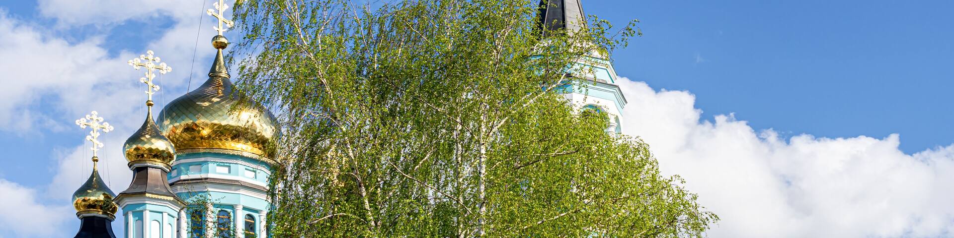 Domes of the Cathedral of St. Tatiana in Cheboksary against the blue sky