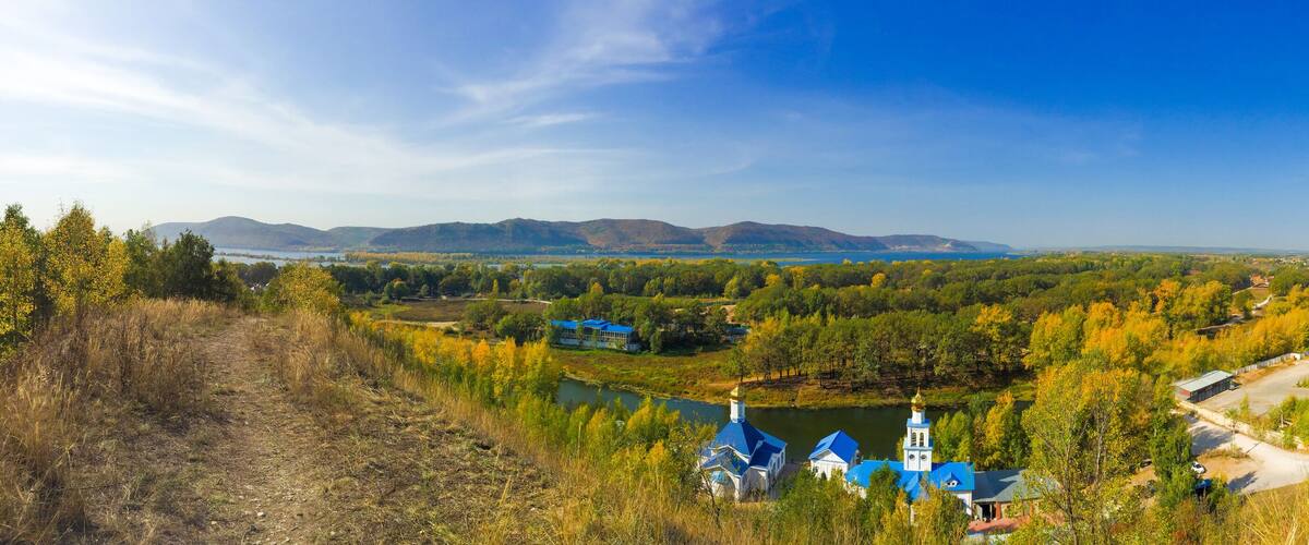 Tsarev Kurgan, Samara region, Russia. Panoramic view on the church of the icon of the Mother of God Inexhaustible Chalice and Zhiguli mountains