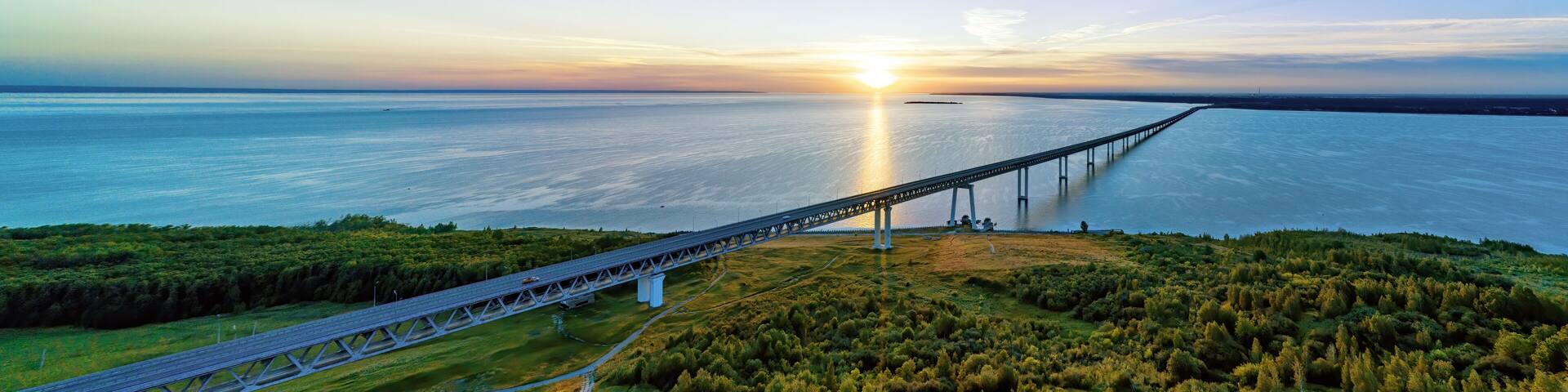 Sunrise over Volga river and President bridge in Ulyanovsk, Russia aerial view