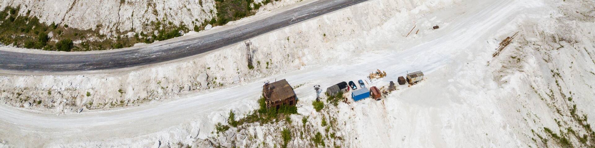 View from drone of unusual White Mountain in Podmoskovye, Russia - large open air slagheap of Lopatinsky phosphate mine