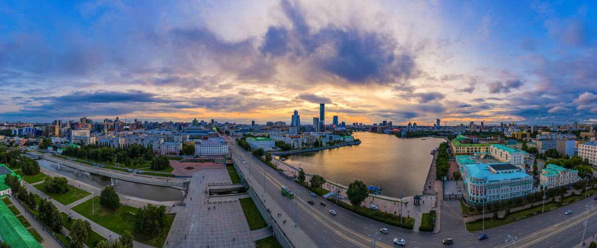 The city center of Ekaterinburg, Skyscrapers behind city pond. Russia. Aerial Photography