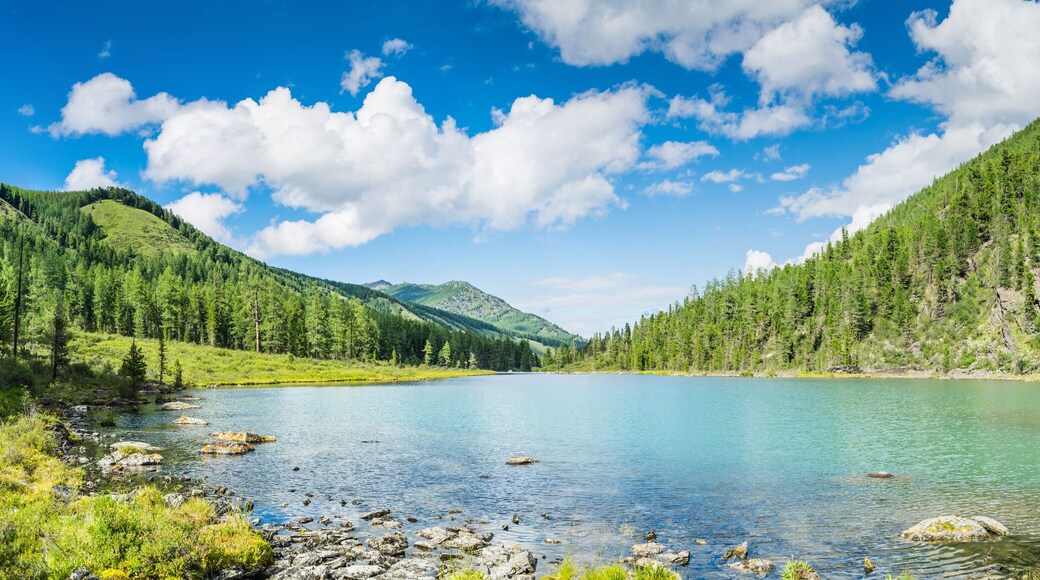 Panoramic view on mountain lake in front of mountain range, national park in Altai republic, Siberia, Russia