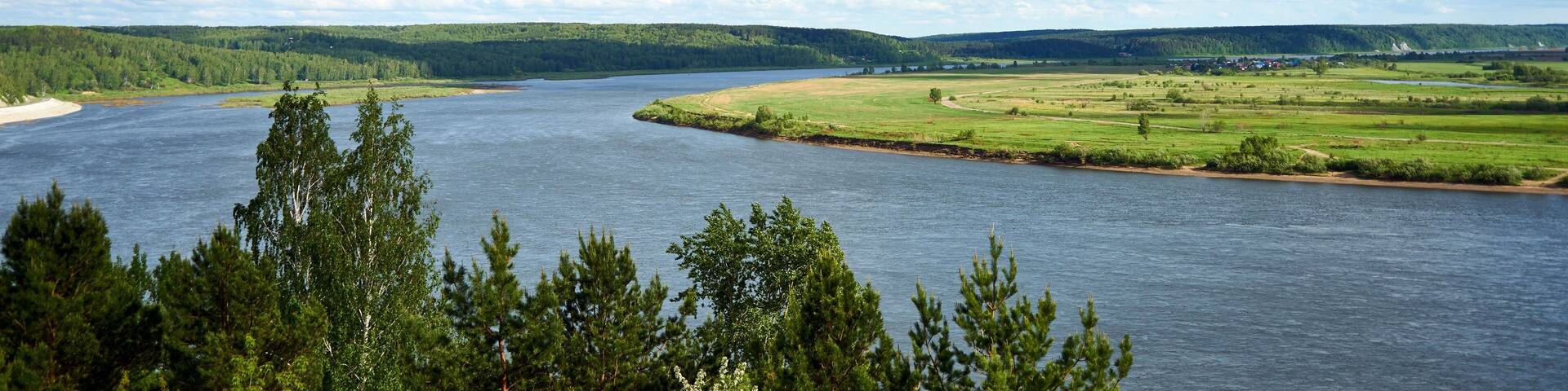 View of Tom River and cloudy sky