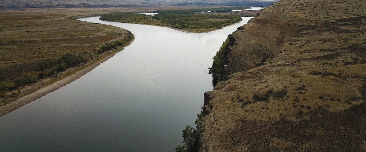 Beautiful landscape of Russian nature. Aerial view of the mountains, the steppe and the Yenisei river in Siberia, Tyva (Republic Tuva). Autumn landscapes. Captured with a drone.