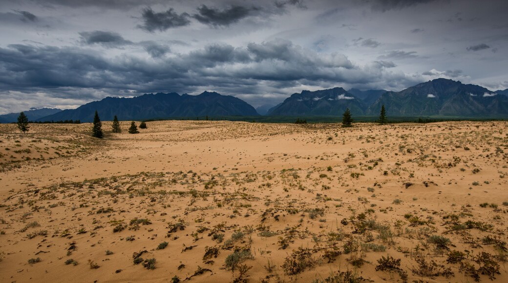 Chara sands and mountains Kodar ridge in Transbaikalia of Eastern Siberia
