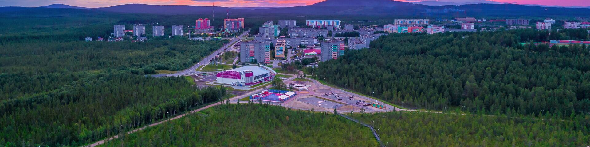 Summer pink polar sunset in the city of Polar Dawns, Polyarnye Zori, Murmansk region.
